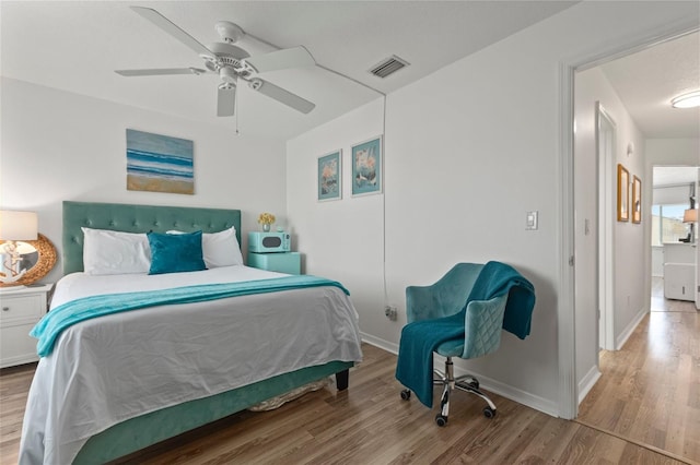 bedroom with hardwood / wood-style flooring and ceiling fan