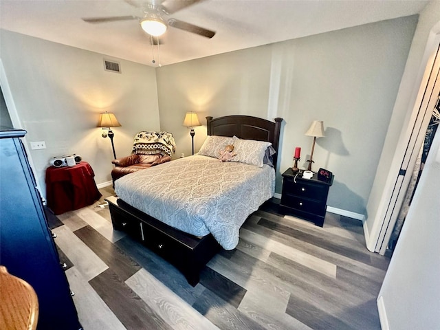 bedroom featuring ceiling fan and dark wood-type flooring