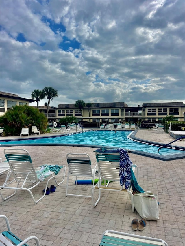 view of swimming pool featuring a patio area