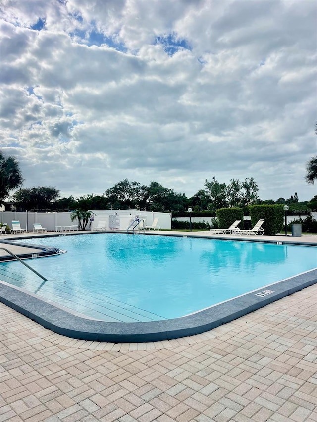 view of swimming pool featuring a patio