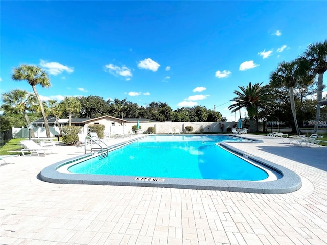 view of swimming pool with a patio area