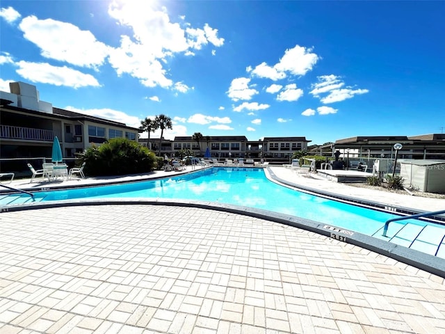 view of swimming pool featuring a patio