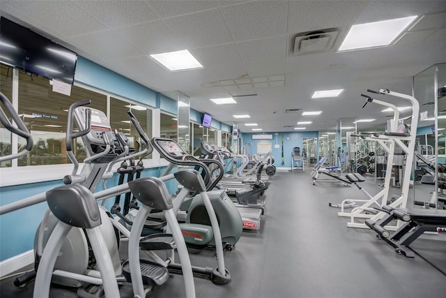 exercise room featuring a paneled ceiling