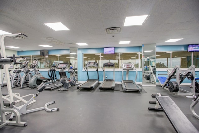 workout area featuring a drop ceiling