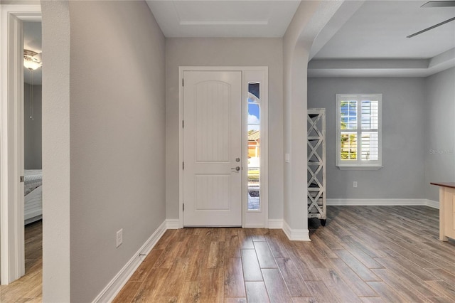 foyer entrance featuring light wood-type flooring and ceiling fan