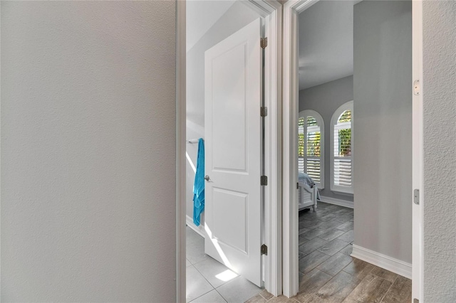 corridor with light wood-type flooring