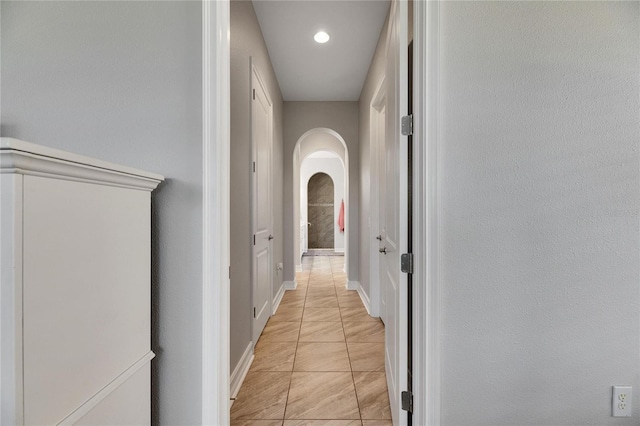 corridor featuring light tile patterned flooring