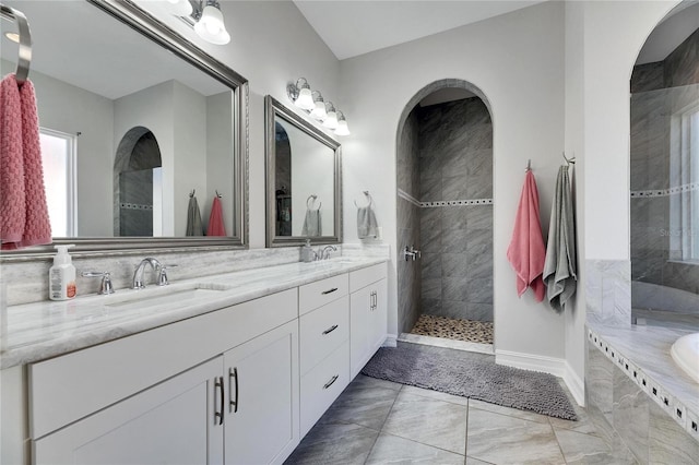 bathroom with vanity and separate shower and tub