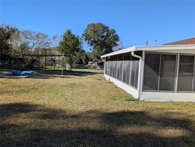 view of yard with a sunroom