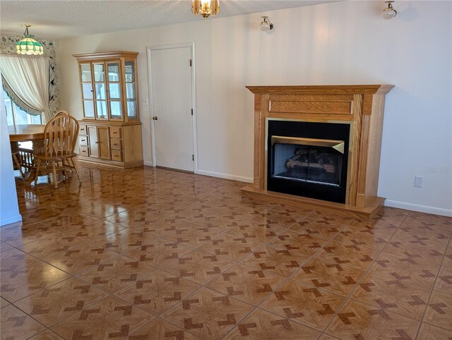 unfurnished living room featuring a textured ceiling