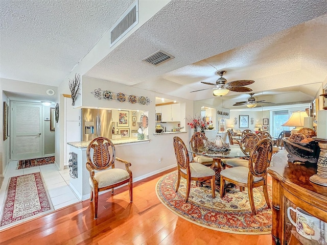 dining area featuring ceiling fan and light hardwood / wood-style floors