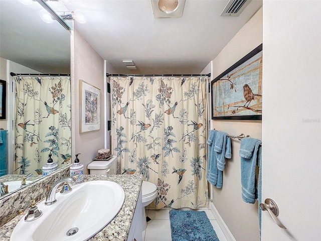 bathroom featuring tile patterned floors, vanity, a shower with shower curtain, and toilet