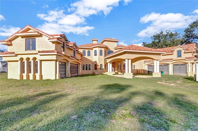 view of front facade featuring a front lawn and a garage