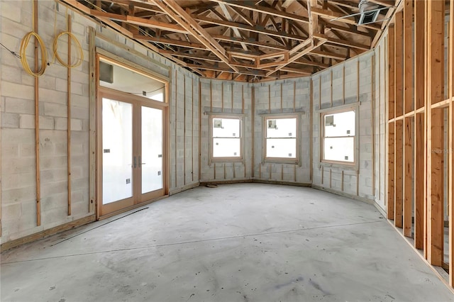 misc room with concrete floors and french doors