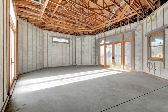 misc room featuring french doors and concrete floors