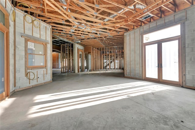 misc room featuring french doors and concrete floors