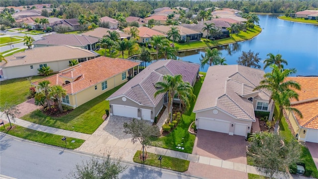 birds eye view of property featuring a water view