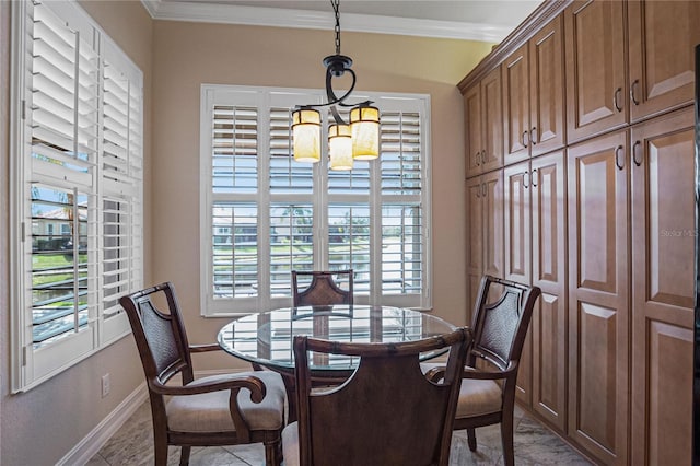 dining space with a notable chandelier, a healthy amount of sunlight, and crown molding