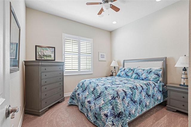 carpeted bedroom with ceiling fan