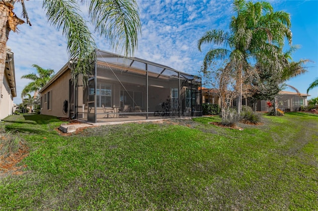 view of yard with glass enclosure