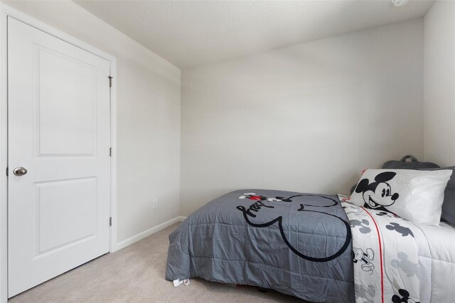 bedroom with light carpet