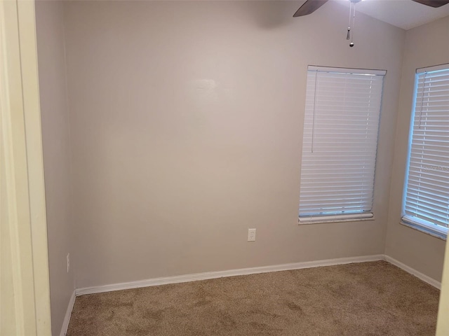 spare room with carpet and ceiling fan