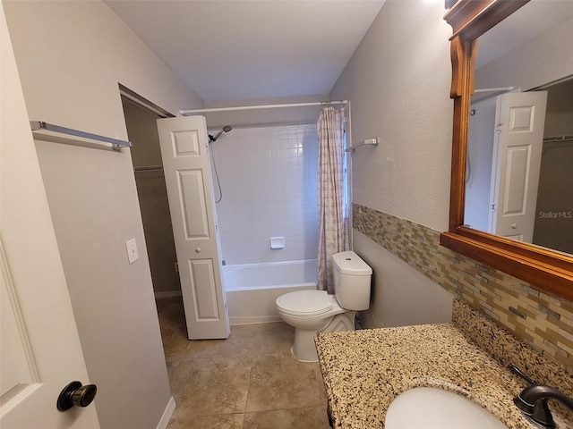 full bathroom with tile patterned floors, toilet, shower / tub combo with curtain, vanity, and decorative backsplash