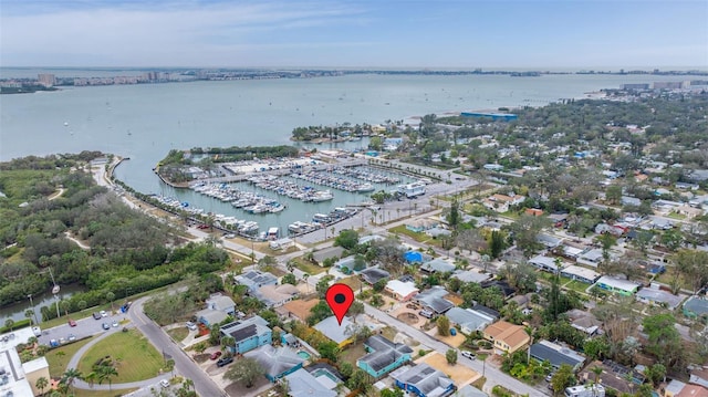 birds eye view of property with a water view