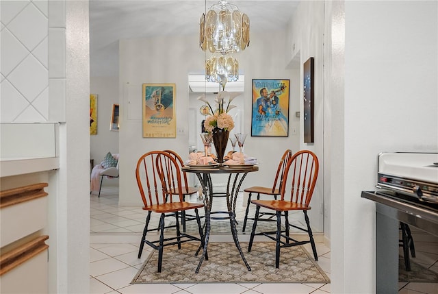 dining space with light tile patterned flooring and a chandelier