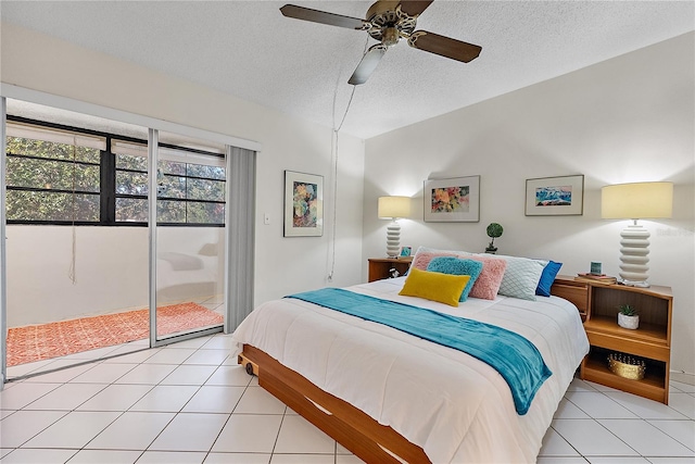 tiled bedroom with ceiling fan, access to outside, and a textured ceiling