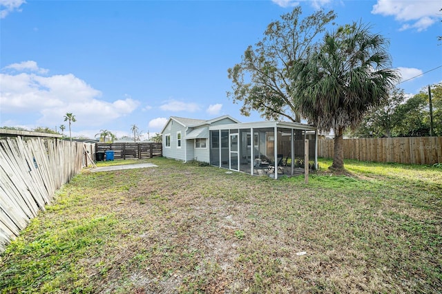 view of yard featuring a sunroom