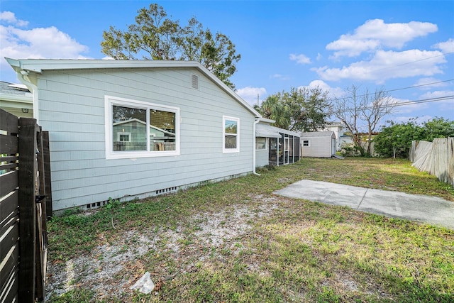 back of house featuring a yard