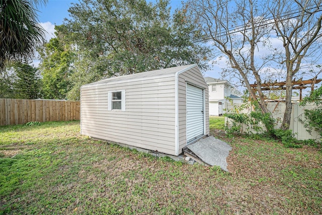 view of outbuilding featuring a yard