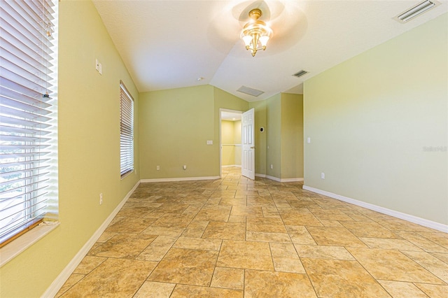 unfurnished room with vaulted ceiling and ceiling fan