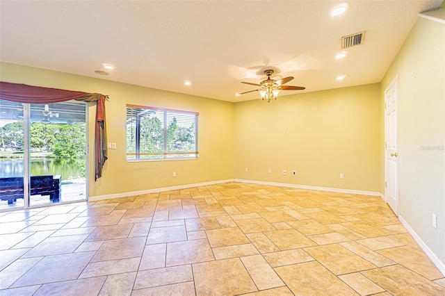 spare room with ceiling fan