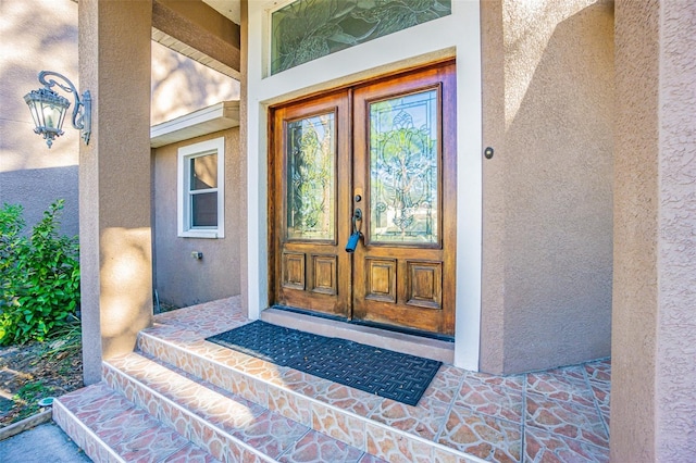 property entrance featuring french doors