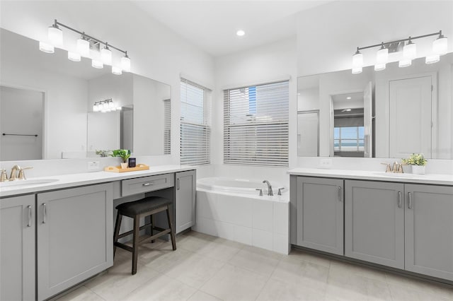 bathroom featuring vanity, tile patterned flooring, and independent shower and bath