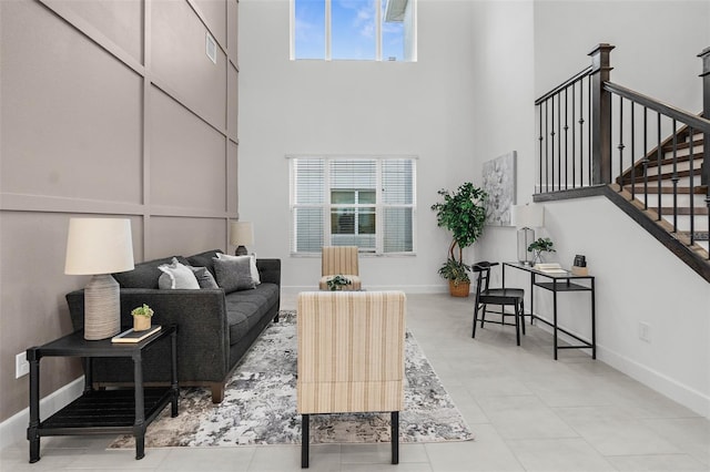 living room with a towering ceiling