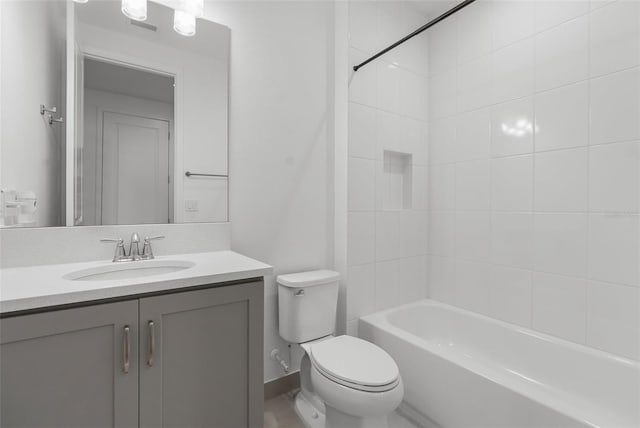 full bathroom with shower / tub combination, vanity, and toilet