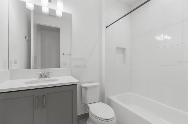 full bathroom with toilet, vanity, and tub / shower combination