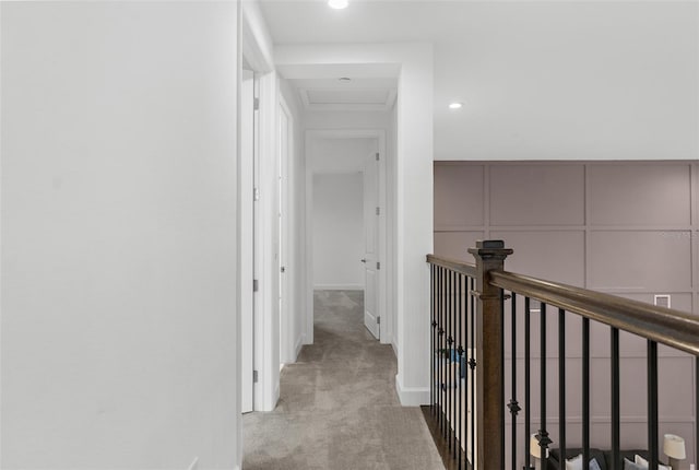 hall featuring light colored carpet