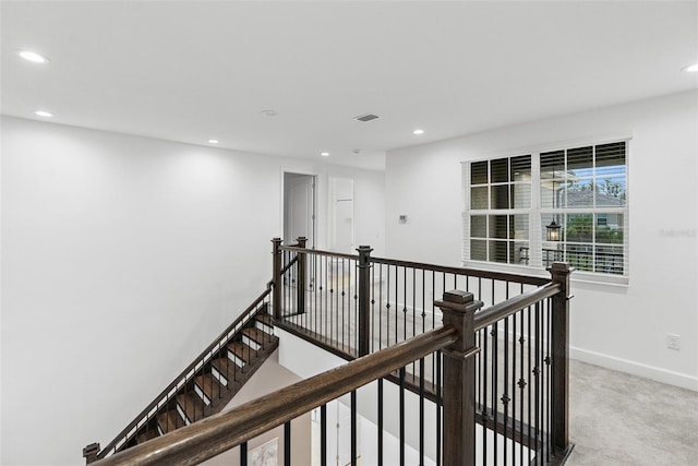 corridor with carpet flooring