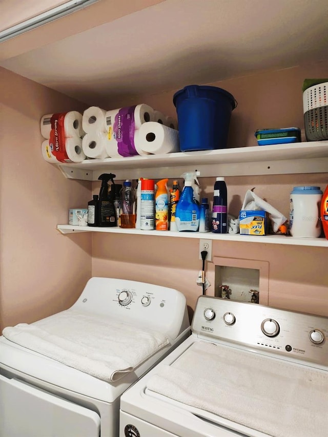 clothes washing area with independent washer and dryer