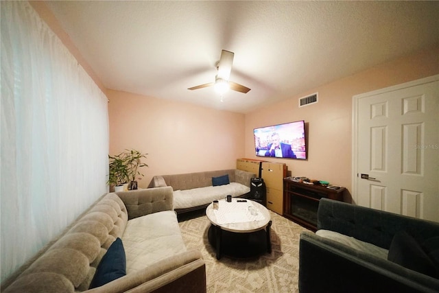 living room featuring ceiling fan