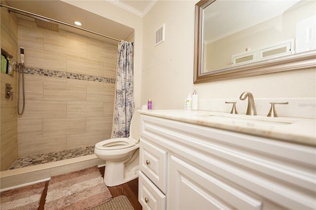 bathroom with hardwood / wood-style floors, vanity, ornamental molding, a shower with curtain, and toilet