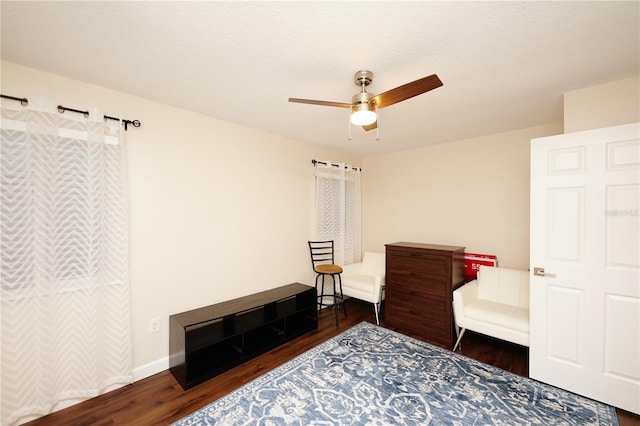 interior space featuring dark hardwood / wood-style flooring and ceiling fan