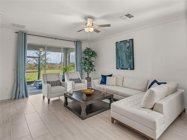 living room with ceiling fan and ornamental molding