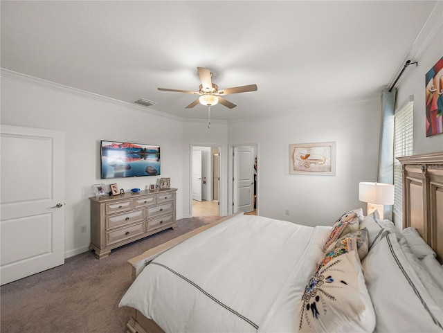 carpeted bedroom with ceiling fan and ornamental molding