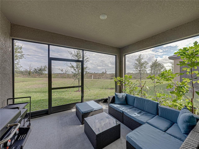 sunroom / solarium featuring a rural view