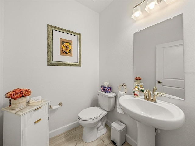 bathroom featuring tile patterned floors, sink, and toilet